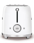 Side view of White toaster with a central control knob on a white background