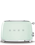 Front view of mint green toaster with 'SMEG' branding on a white background