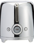 Side view of stainless steel Smeg toaster with a stop button on a white background