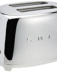 Stainless steel toaster with 'Smeg' branding on a white background