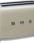 Front view of cream toaster with 'Smeg' branding on a white background
