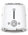 Side view of White toaster with silver accents with dial control on a white background