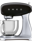 Smeg stand mixer with black top and silver base on a white background