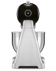 Back view of Stainless steel stand mixer with black attachments on a white background