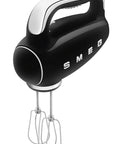 Black hand mixer with 'Smeg' branding on a white background