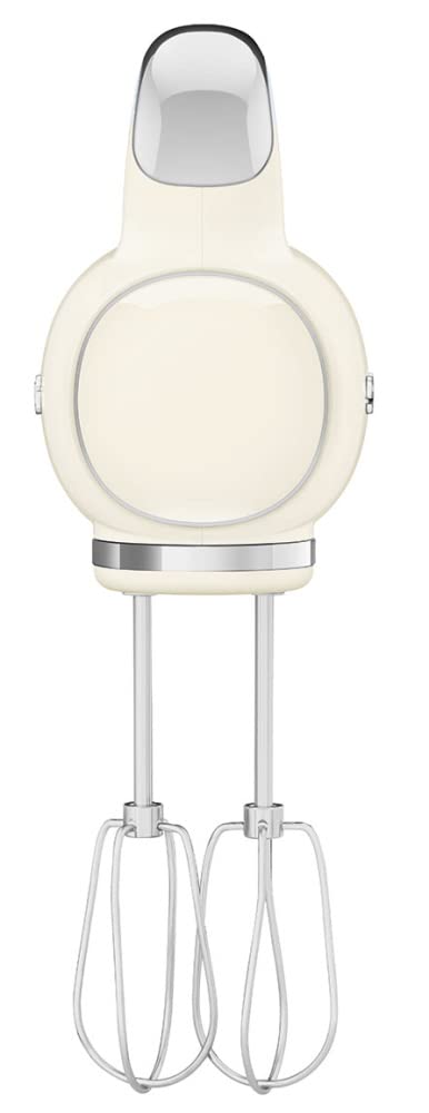 Side view of Smeg hand mixer with a cream body and silver accents on a white background