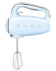 Front view of Pastel blue Smeg hand mixer displayed on a white background