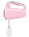Front view of pink hand mixer with 'SMEG' branding on a white background