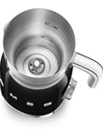 Top view of black Smeg milk frother with silver top displayed on a white background