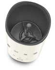 Top view of cream SMEG milk frother displayed on a white background