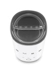 White SMEG milk frother shown from a top-down angle on a white background.