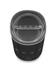 A top-down view of a black SMEG milk frother with a clear plastic lid, showing the brand name 'SMEG' on the lid and front.