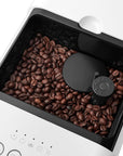 Coffee machine with a coffee grinder with coffee beans inside on a white background
