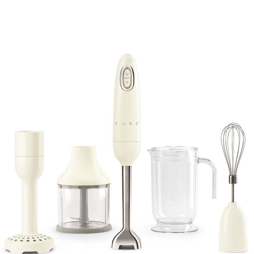 Cream Smeg hand mixer including a blender, chopper, and whisk on a white background