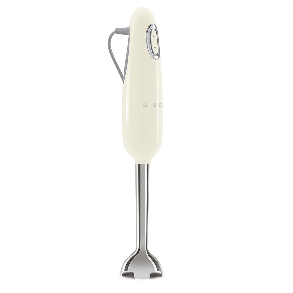 Side view of cream Smeg hand mixer displayed on a white background