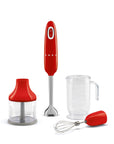 Red Smeg hand blender with attachments on a white background