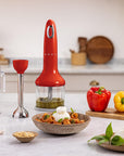 Red kitchen blender on a counter with ingredients and utensils in a kitchen setting