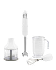 White Smeg handheld immersion blender with attachments displayed on a white background