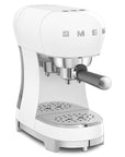 White Smeg espresso machine with chrome accents on a white background