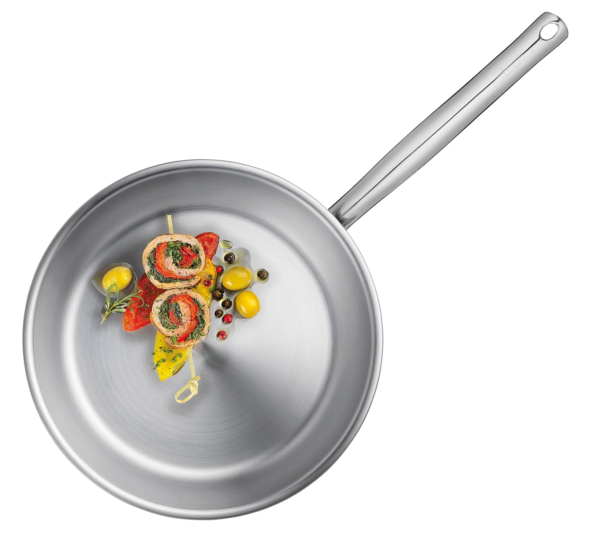 Stainless steel frying pan with food on a white background
