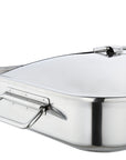 Close up of handle of stainless steel roasting pan with lid on a white background