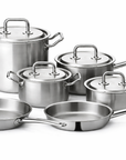 Set of stainless steel cookware with lids on a white background