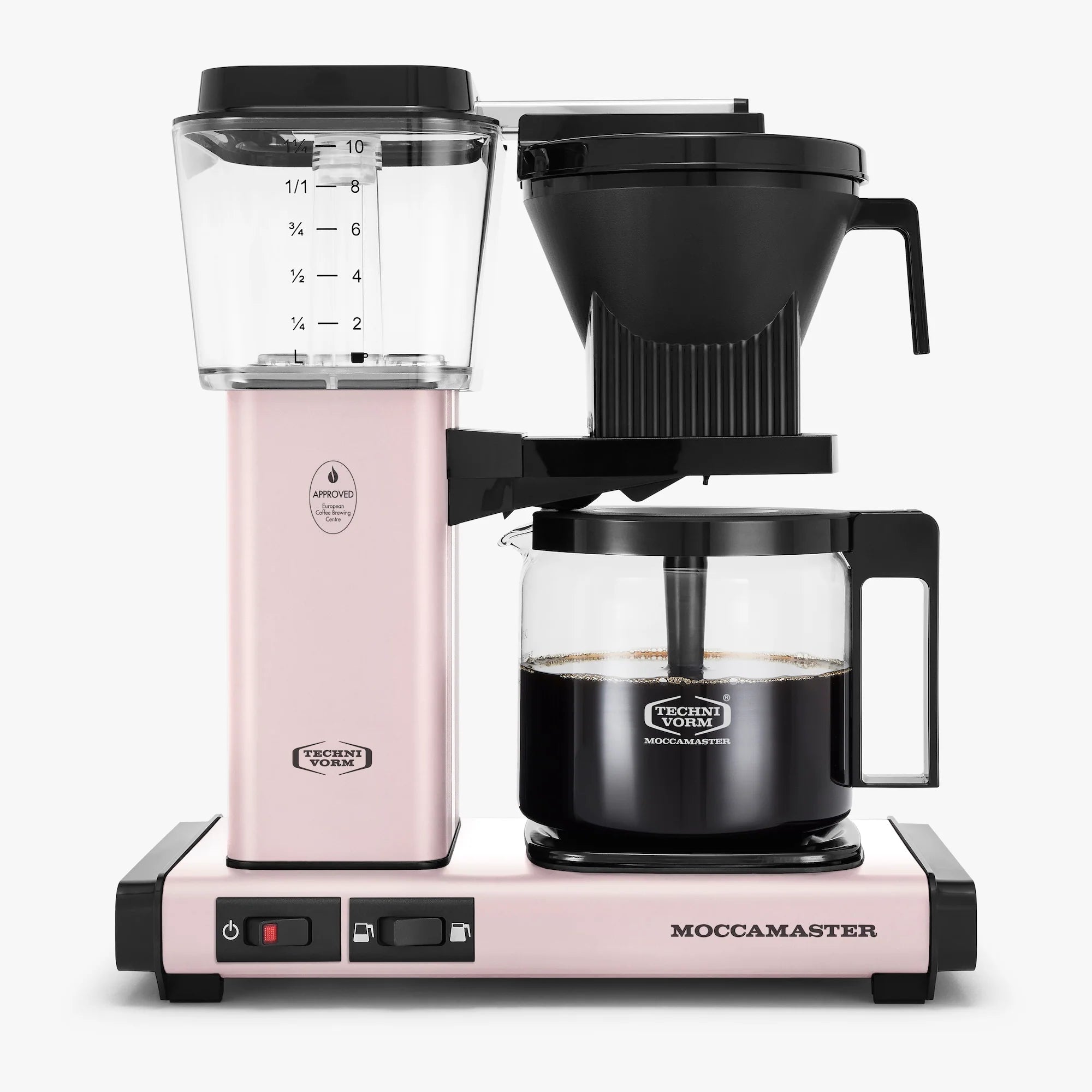 Pink Moccamaster coffee maker with clear carafe on a white background