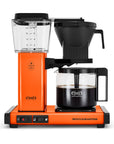 Orange Moccamaster coffee maker on a white background