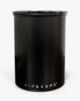 Back side of Black Moccamaster coffee storage canister on a white background