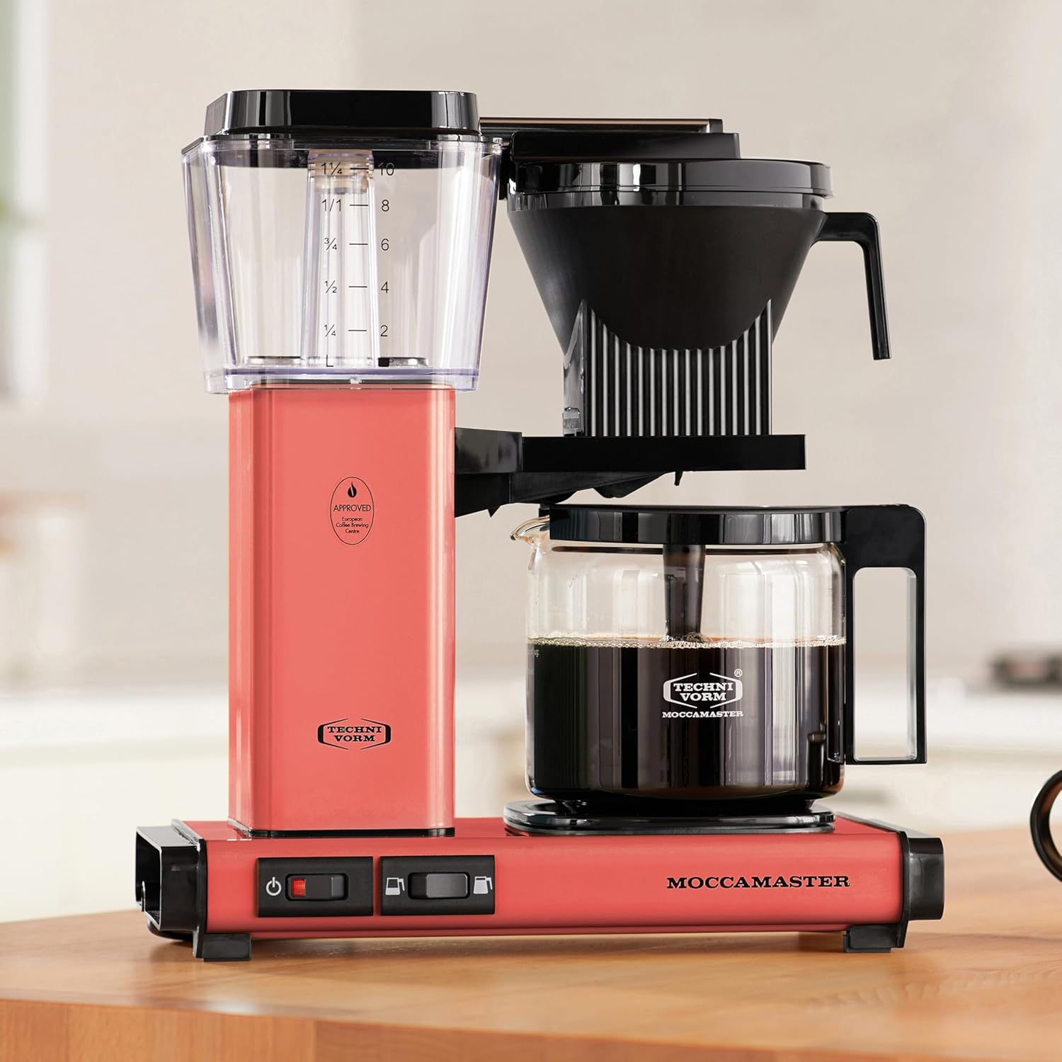 Sorbet Moccamaster coffee maker on a wooden surface with a blurred background