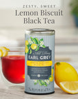 Can of All Day Earl Grey Lemon Biscuit Black Tea with a glass of tea and lemons on a blurred background
