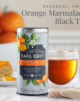 Can of Earl Grey Orange Marmalade Black Tea with a glass of tea and oranges in the background