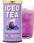 Purple canister of 'ICED TEA' with a glass of purple iced tea on a white background