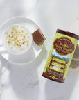Dubai Chocolate tea canister with a cup of tea and a chocolate bar on a marble surface