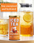 Republic of Tea iced tea packaging with a glass of iced tea and lemon slice on a table inside.