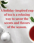 Teacup with red tea, Christmas ornaments, and holly leaves on a white background with text about holiday tea.