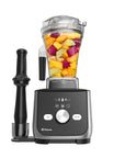 Vitamix blender with fruit ingredients on a white background