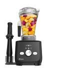 Black Vitamix blender with a clear container filled with fruits on a white background
