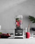 Blender with ingredients on a kitchen counter