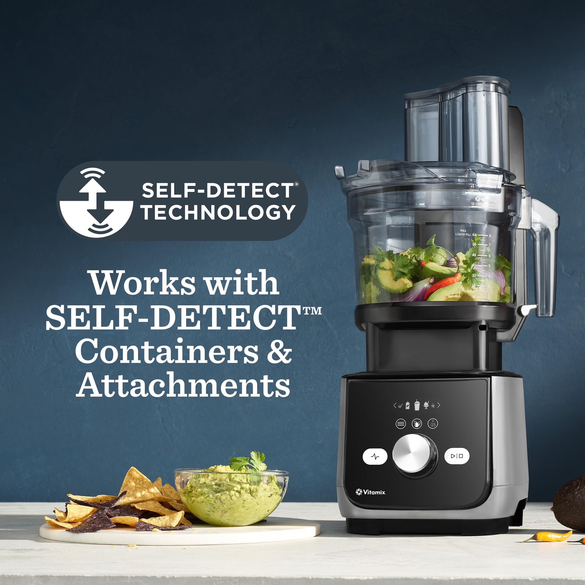 Vitamix food processor with ingredients on a counter, featuring self-detect technology text.