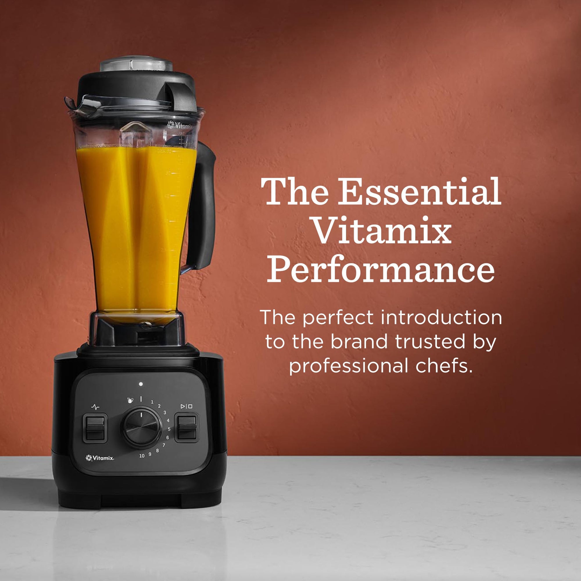 Vitamix blender with orange liquid inside with text about The Essential Vitamix Performance on an orange background