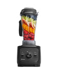 Vitamix blender with an assortment of fruits inside displayed on a white background