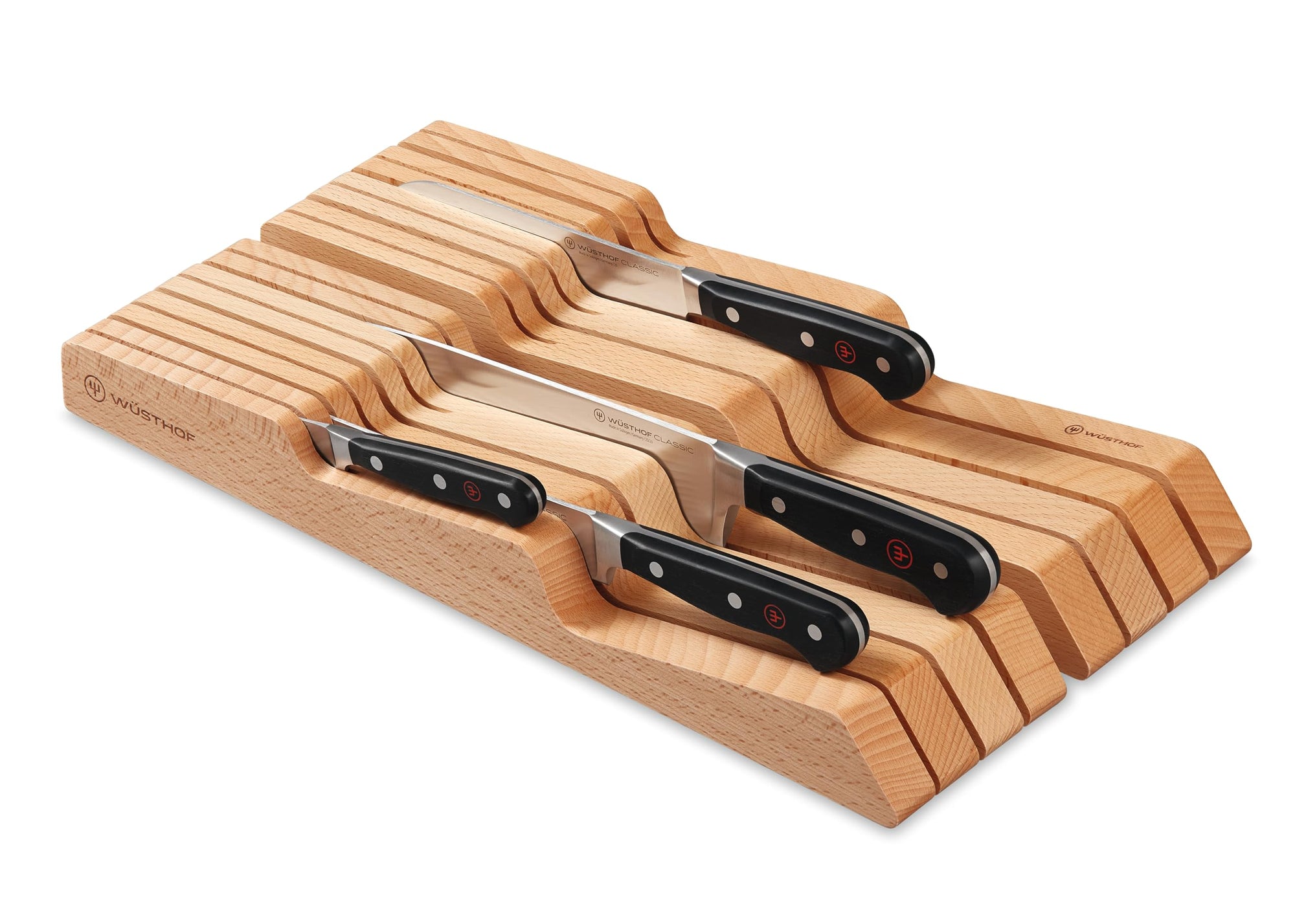 Set of knives with wooden holder on a white background