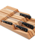 Set of knives with wooden holder on a white background