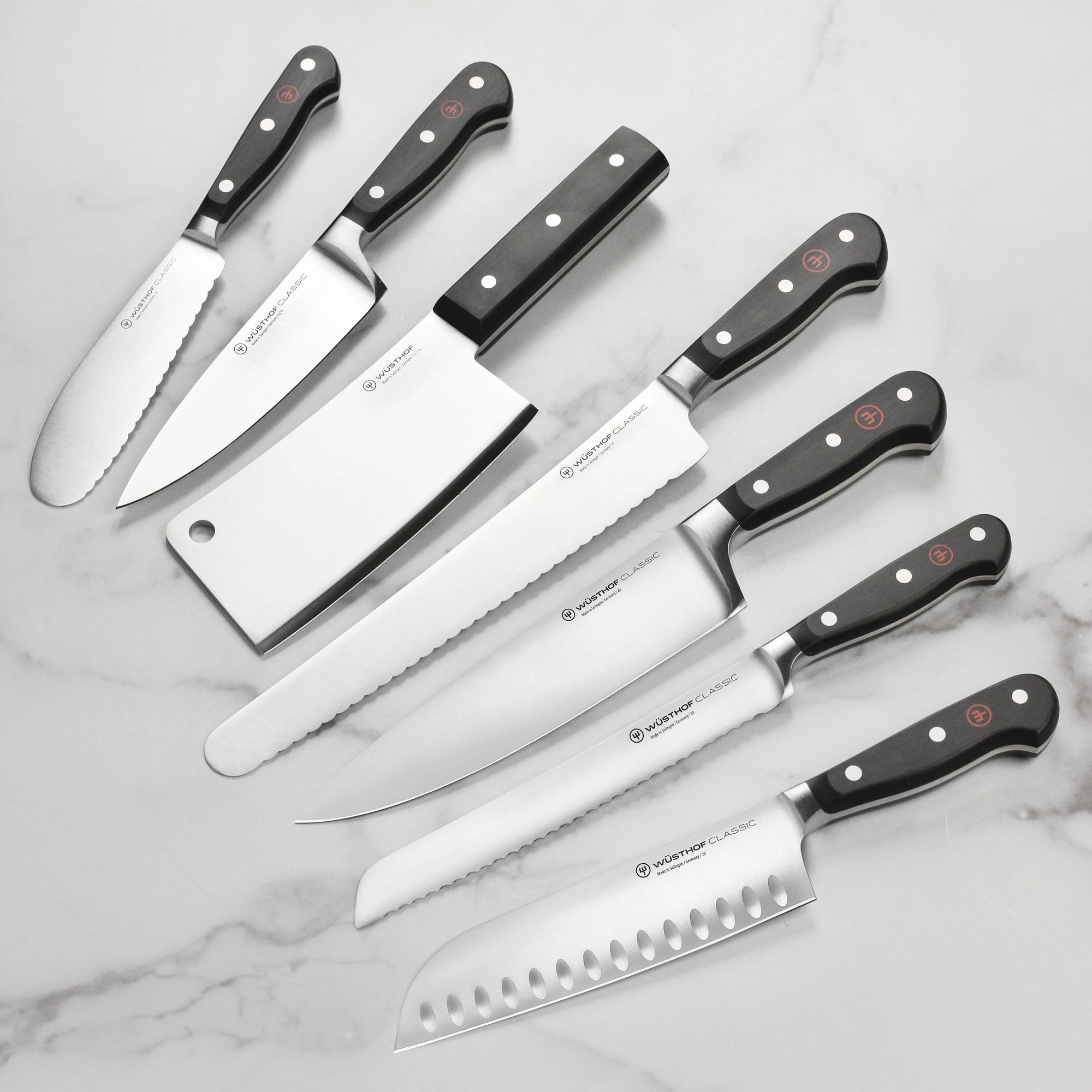Set of Wüsthof knives on a marble surface