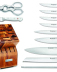 Set of knives with a wooden block on a white background