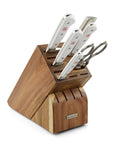Wooden knife block set with knives and a pair of shears on a white background