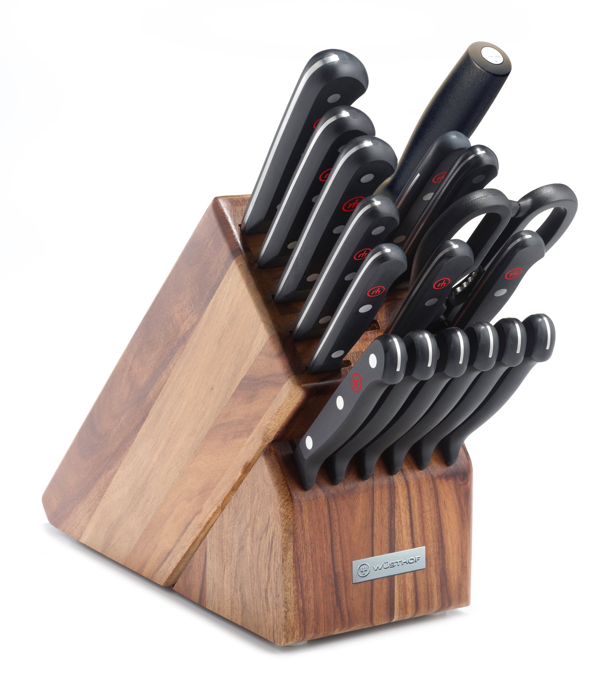 Set of knives in a wooden block on a white background