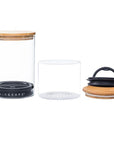 Two glass containers with various lids on a white background, featuring the 'AIRSCAPE' brand.